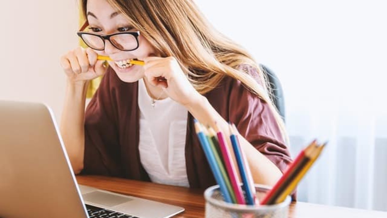 Woman watching on laptop