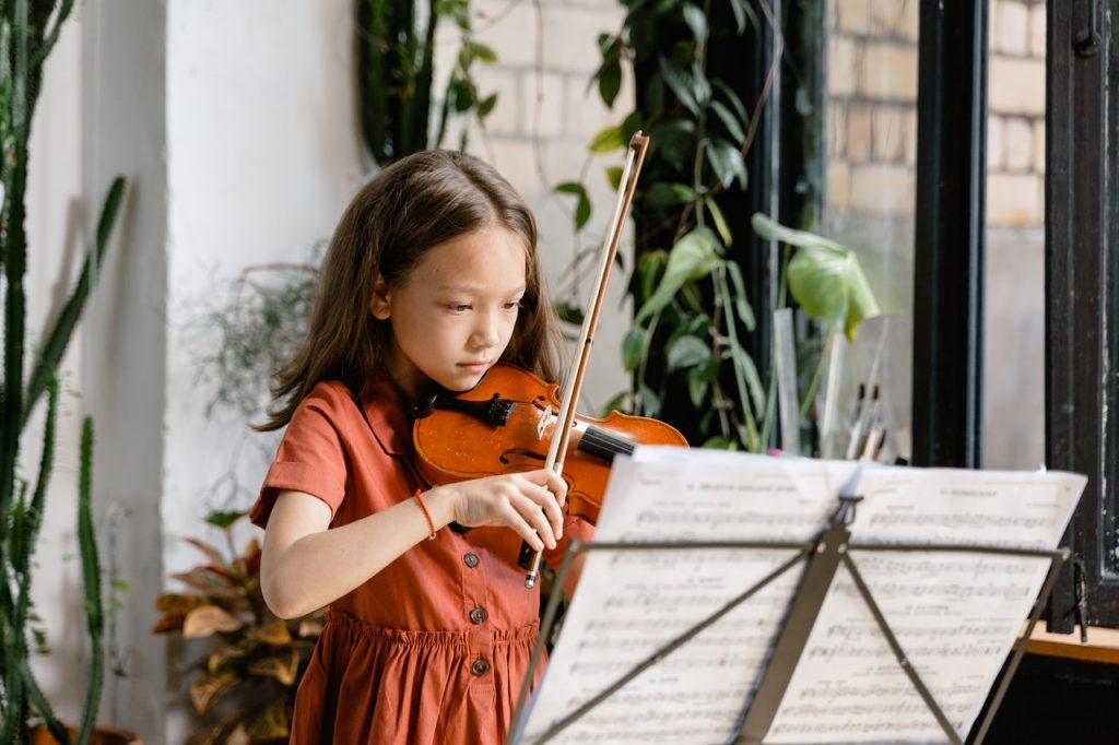 child playing musical instrument